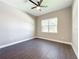 Well-lit bedroom featuring dark grey flooring and a ceiling fan at 1793 Lakehill Dr, Winter Haven, FL 33884