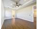 Main bedroom with hardwood floors and ensuite bathroom access at 1793 Lakehill Dr, Winter Haven, FL 33884