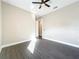 Sunlit bedroom with dark grey flooring and ceiling fan at 1793 Lakehill Dr, Winter Haven, FL 33884