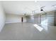 Spacious two-car garage with epoxy flooring and ample storage at 1793 Lakehill Dr, Winter Haven, FL 33884