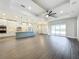 Open concept kitchen with island, stainless steel appliances, and white cabinets at 1793 Lakehill Dr, Winter Haven, FL 33884