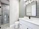 Elegant bathroom with white vanity, quartz countertop, and a walk-in shower at 1793 Lakehill Dr, Winter Haven, FL 33884
