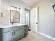 Modern bathroom with green vanity, quartz countertop, and walk-in shower at 1793 Lakehill Dr, Winter Haven, FL 33884