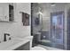 Updated bathroom with a walk-in shower and modern fixtures at 1441 S Lake Roy Dr, Winter Haven, FL 33884