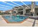 Inviting swimming pool with brick coping and screened enclosure at 1441 S Lake Roy Dr, Winter Haven, FL 33884