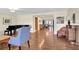 Living room features hardwood floors and view to dining room at 1441 S Lake Roy Dr, Winter Haven, FL 33884