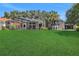 Large backyard with lush green grass at 1441 S Lake Roy Dr, Winter Haven, FL 33884