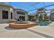 Relaxing hot tub with brick surround next to the pool at 1441 S Lake Roy Dr, Winter Haven, FL 33884