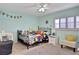 bedroom with a full-size bed and playful decor at 1441 S Lake Roy Dr, Winter Haven, FL 33884
