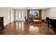 Spacious living room with hardwood floors and natural light at 1441 S Lake Roy Dr, Winter Haven, FL 33884