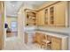 Home office with built-in desk and granite countertop at 1441 S Lake Roy Dr, Winter Haven, FL 33884