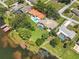 Aerial view showcasing waterfront property and homes at 1441 S Lake Roy Dr, Winter Haven, FL 33884
