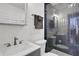 Updated bathroom with a walk-in shower and modern fixtures at 1441 S Lake Roy Dr, Winter Haven, FL 33884