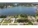 Wide aerial view of lakefront community and homes at 1441 S Lake Roy Dr, Winter Haven, FL 33884