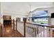 Upstairs hallway overlooking game room and pool at 1441 S Lake Roy Dr, Winter Haven, FL 33884