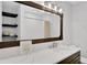 Bathroom with a modern vanity, quartz countertop, and geometric tile shower at 1441 S Lake Roy Dr, Winter Haven, FL 33884