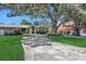 House exterior showcasing landscaping and driveway at 1441 S Lake Roy Dr, Winter Haven, FL 33884