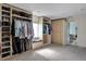 Large walk-in closet with built-ins and access to bathroom at 1441 S Lake Roy Dr, Winter Haven, FL 33884