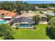 Aerial view of house, pool, and backyard at 1441 S Lake Roy Dr, Winter Haven, FL 33884
