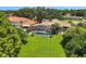 Aerial view of house with pool and large backyard at 1441 S Lake Roy Dr, Winter Haven, FL 33884