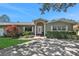 Charming single story home with a well-maintained front yard at 1441 S Lake Roy Dr, Winter Haven, FL 33884