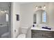 Bathroom with a large vanity and a walk-in shower at 1441 S Lake Roy Dr, Winter Haven, FL 33884