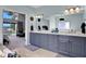 Double vanity bathroom with a view of the bedroom and lake at 1441 S Lake Roy Dr, Winter Haven, FL 33884