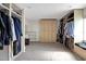 Large walk-in closet with ample shelving and hanging space at 1441 S Lake Roy Dr, Winter Haven, FL 33884
