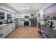 Updated kitchen, featuring stainless steel appliances and white cabinetry at 1004 Avenue G Ne, Winter Haven, FL 33881