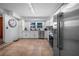 Modern kitchen with stainless steel appliances and white cabinets at 1004 Avenue G Ne, Winter Haven, FL 33881