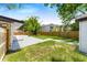 Backyard with grassy area, patio, and fence at 1004 Avenue G Ne, Winter Haven, FL 33881
