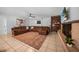 Spacious living room with a cozy fireplace and sectional sofa at 1004 Avenue G Ne, Winter Haven, FL 33881