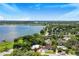 Aerial view of a house near a lake, showcasing its location and surrounding landscape at 1004 Avenue G Ne, Winter Haven, FL 33881