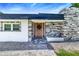 Inviting home exterior with stone accents and a charming walkway at 1004 Avenue G Ne, Winter Haven, FL 33881
