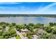 Aerial view of a house near a lake, showcasing its location and surrounding landscape at 1004 Avenue G Ne, Winter Haven, FL 33881
