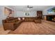 Spacious living room with a cozy fireplace and sectional sofa at 1004 Avenue G Ne, Winter Haven, FL 33881