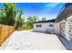 Backyard with paver patio, wood fence, and detached shed at 1004 Avenue G Ne, Winter Haven, FL 33881