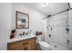 Updated bathroom with a single vanity and shower/tub combo at 1004 Avenue G Ne, Winter Haven, FL 33881