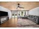 Gathering room with wood-paneled ceiling, and french doors to backyard at 1004 Avenue G Ne, Winter Haven, FL 33881