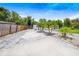 Landscaped front yard with a paved driveway at 1004 Avenue G Ne, Winter Haven, FL 33881