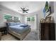 Bedroom with a queen bed, nightstands, and a dresser at 1004 Avenue G Ne, Winter Haven, FL 33881