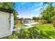 Backyard view showing house, shed and landscaping at 1004 Avenue G Ne, Winter Haven, FL 33881