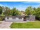 House exterior view with landscaping and driveway at 1004 Avenue G Ne, Winter Haven, FL 33881