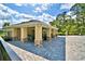 Relaxing poolside cabana with tables and chairs at 1155 Berry Ln, Davenport, FL 33837