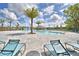 Resort-style pool with a water feature and plenty of seating at 1155 Berry Ln, Davenport, FL 33837