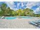Inviting community pool with a waterslide and lounge chairs at 1155 Berry Ln, Davenport, FL 33837