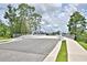Modern pedestrian bridge with sidewalks and landscaping at 1155 Berry Ln, Davenport, FL 33837