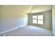 Spacious bedroom with carpeted floor and large window at 1155 Berry Ln, Davenport, FL 33837