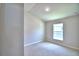 Simple bedroom with single window and carpet flooring at 1155 Berry Ln, Davenport, FL 33837