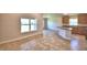 Modern kitchen featuring wood cabinets and an island at 1155 Berry Ln, Davenport, FL 33837